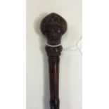 A Bamboo Sword Stick Walking Cane with novelty "Mr Punch" head to handle.
