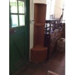 A G-Plan teak bow front corner cupboard; A Similar Corner Shelf