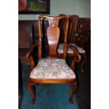 A set of four Queen Anne style carver chairs, with tapestry type seats drop in seats, raised on