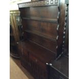 An Early 20th Century oak dresser and rack, of recent manufacture, the rack with three plate