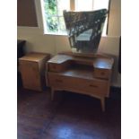 A mid 20th Century part bedroom suite, comprising an oak dressing table with mirrored back and a