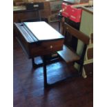 An early 20th century oak childs school desk attached with a folding seat.