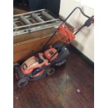 A Black and Decker electric lawn mower