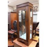 A modern oak corner cabinet, together with a small oak side unit, each with lead effect glazing (2)