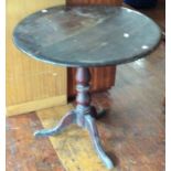 A George III mahogany tilt-top table on tripod cabriole legs, c.1820