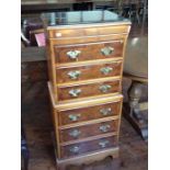 A Georgian style yew veneered chest on chest, fitted with six drawers, 118cm high, 51cm wide, 38cm