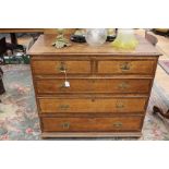 A George III oak chest of drawers, c.1800 fitted with two short over three long graduated drawers,