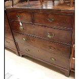 A George III Mahogany Chest of Drawers, the top with a cross-banded edge, fitted with two short over