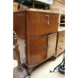 A mid 20th Century mahogany cocktail cabinet, cabriole feet