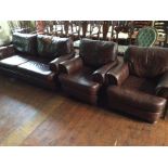 A contemporary brown leather three piece suite, comprising a two seater settee and a pair of