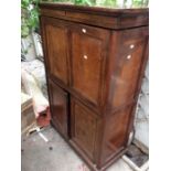 A French walnut fall front bureau, panelled doors below revealing a drawered and shelved interior.