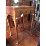 An early 20th Century Queen Anne style walnut veneered side table, fitted with a single drawer,