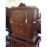 A Modern hardwood Canterbury chest, three tier drawers plus a cupboard.