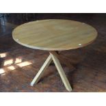 A contemporary oak circular topped table, with a straight leg twist support structure, 74cm high,