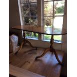 A Reproduction Elm veneered Twin Pedestal Coffee Table, supported on tripod Cabriole Legs on Castors