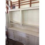A large white painted dresser and rack