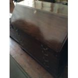 A George III mahogany bureau, c.1780, fitted interior with drawers below