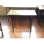 A late Victorian mahogany writing table, leather inset top, fitted with a single drawer, turned