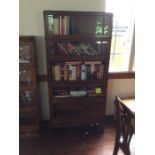 An Early 20th Century Oak stackable five tier Globe Wernicke Bookcase fitted raising glass inlaid