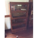 An Early 20th Century Oak Stackable four tier Globe Wernicke Bookcase fitted raising glass inlaid