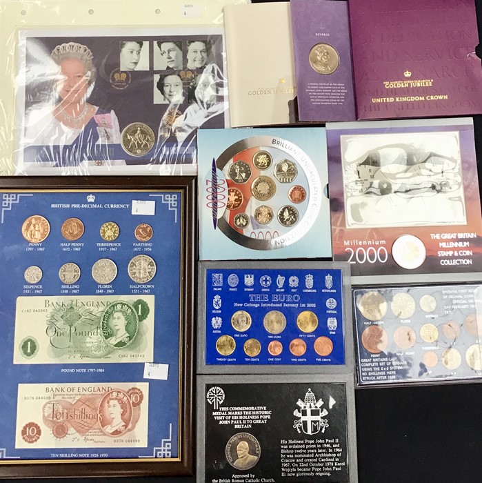 A Case of UK & World Coins and Banknotes with Cased Sets and Packs.