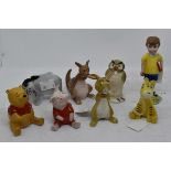 Eight Beswick Winnie the Pooh statues