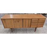 A 1960's Portwood Studios Teak Dining Sideboard on tapered supports,