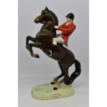 Beswick statue of a huntsman on rearing horse,