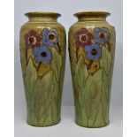 Pair of early 20th Century Royal Doulton tall vases with floral detail,