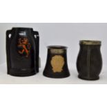 Doulton Lambeth two handled vase, black bodied with red lion decoration on both sides,