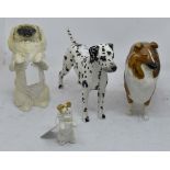 Four Beswick dog statues including;