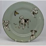 Royal Doulton Cecil Aldin plate, green ground with various dog pictures Minor chip to rim.