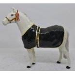 Beswick White Welsh Mountain Show Pony with dark green day rug, head collar and rosette,