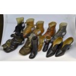 Assorted ceramic period style boots/shoes statues, various makers, including one with silver rim,
