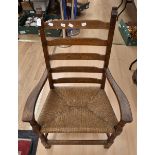 A Rupert Griffiths Solid Oak Fireside Rush Seated Armchair