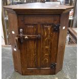 A Rupert Griffiths Solid Oak Carved Corner cabinet