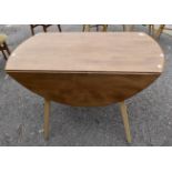 A 1970's Ercol Elm Dining Dropleaf Table with four Dining Chairs,