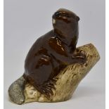 Beswick beaver on log facing right,