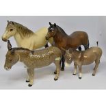 Four Beswick figures including Dartmoor pony number 1642, Highland pony number 1644,