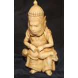 A 19th century Chinese carved ivory figure of Sun Wukong the monkey king, carved seated upon throne,