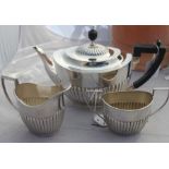 A matched three piece silver tea service, the teapot by William Hutton & Sons Ltd, assayed London