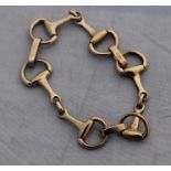 A 9ct. yellow gold "stirrup" link bracelet, hallmarked for 9 carat gold, assayed Sheffield, length