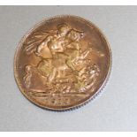 A 1910 George V gold sovereign, London mint.