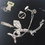 A collection of white metal and marcasite set jewellery, to include; An Art Deco scarf clip, two