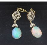 A pair of yellow metal, precious opal and diamond drop earrings, each having open work lozenge