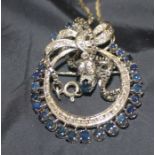 A white metal, sapphire and diamond "hoop" pendant-brooch, of open work circular form, having