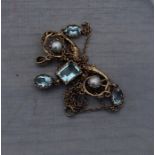 A precious yellow metal, aquamarine and pearl pendant necklace, the open work pendant fashioned as a