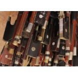 A collection of violin bows