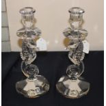 A pair of Waterford crystal "Seahorse" candlesticks, with seahorse columns, etched "Waterford" to