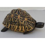 An early 20th century "tortoise" jewellery casket, fashioned from tropical hardwoods and the shell